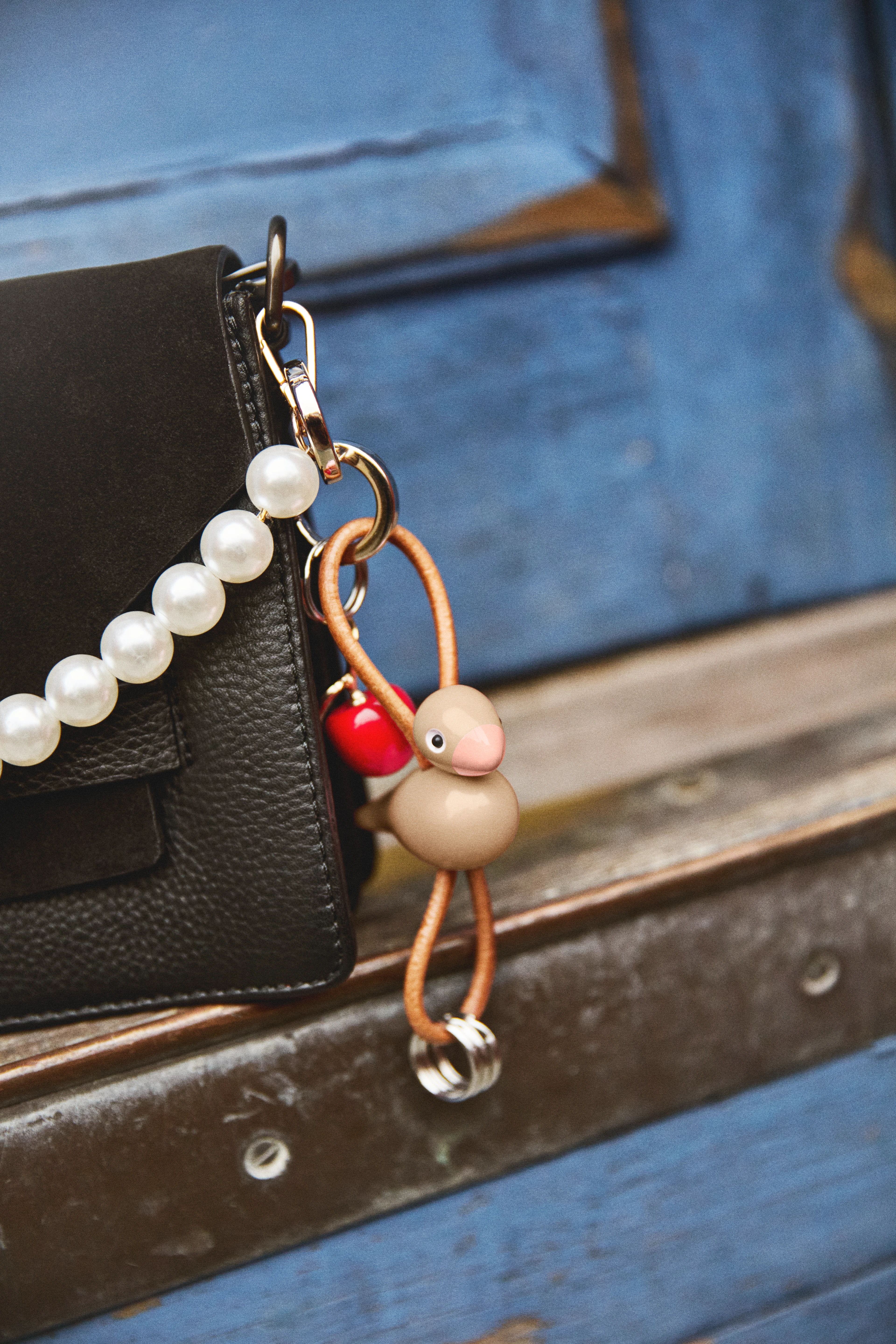 Bird silver metal Keychain with Natural Leather from Kay Bojesen in Mocca color, made of Wood