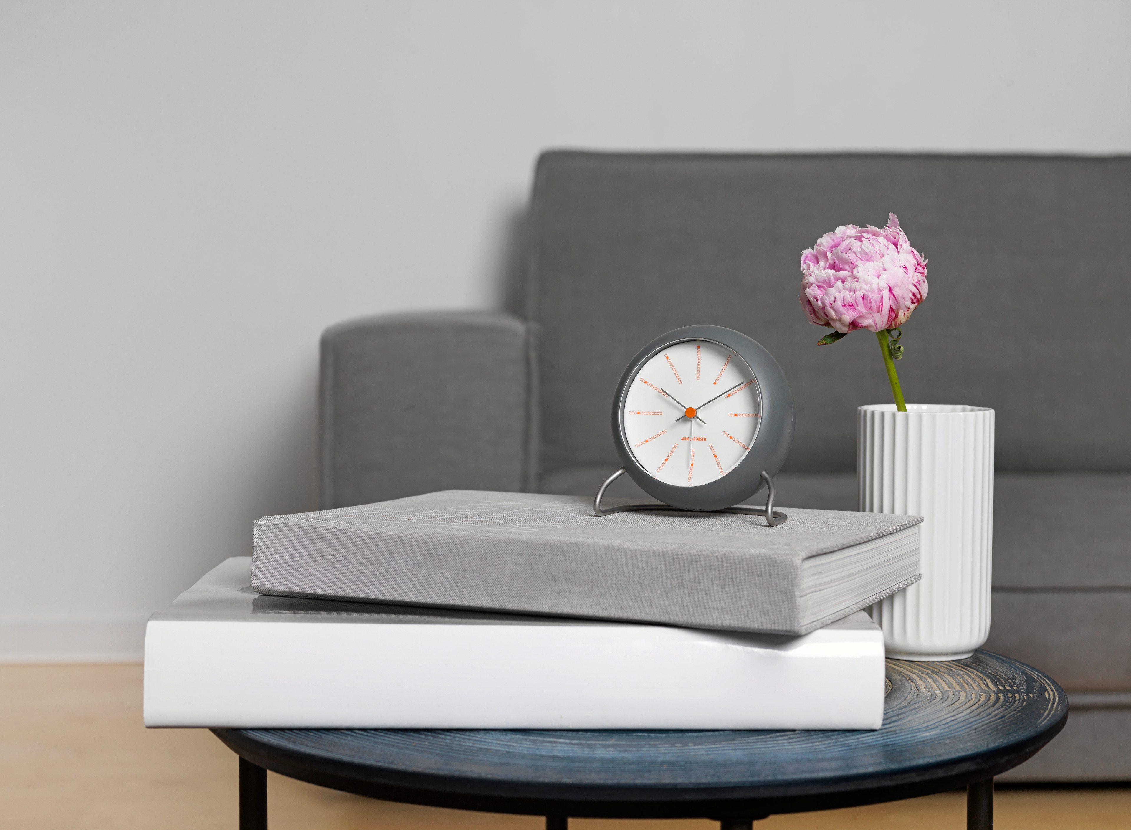Alarm clock from Arne Jacobsen Clocks on coffee table