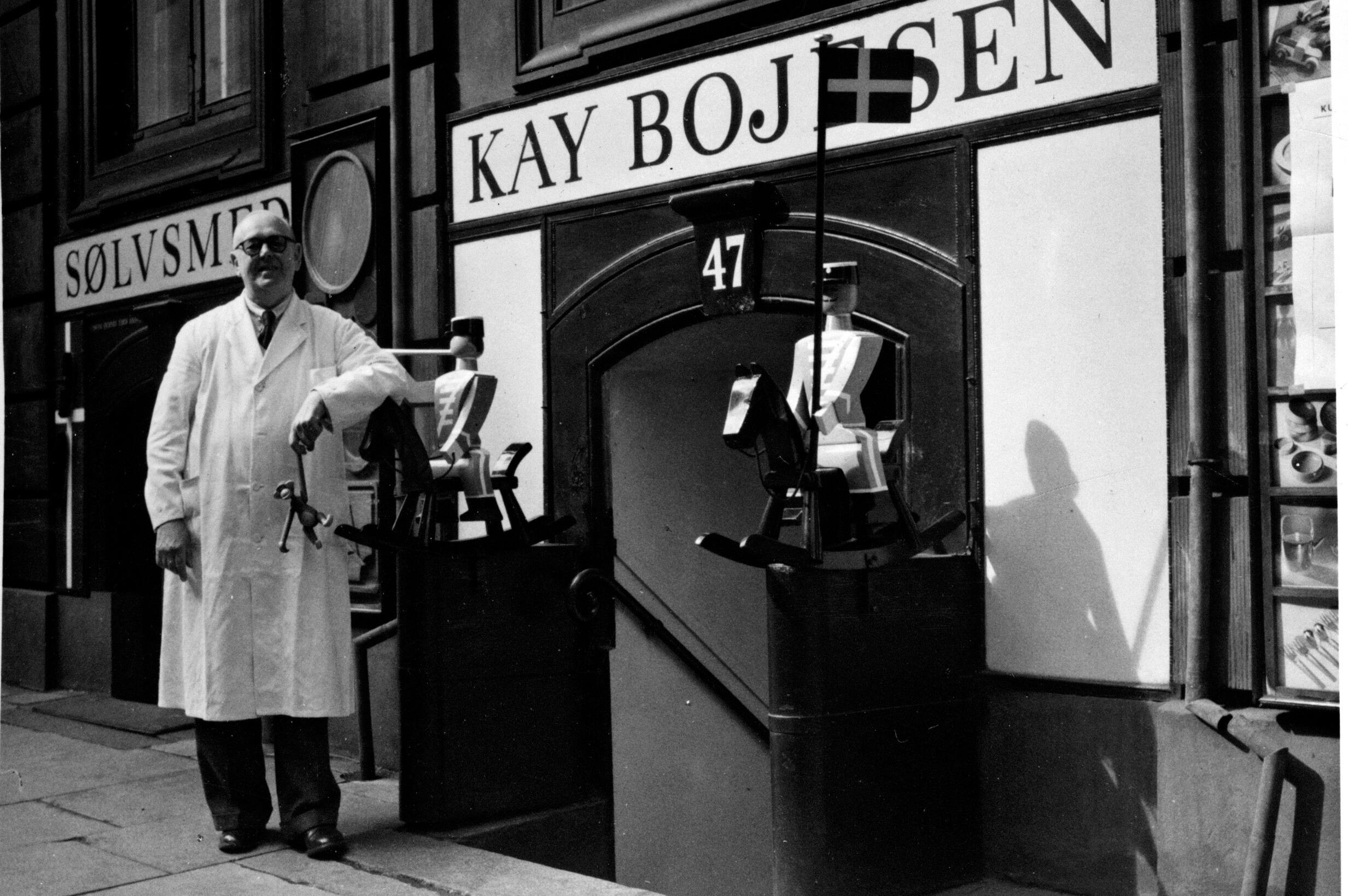 Kay Bojesen out in front of his shop