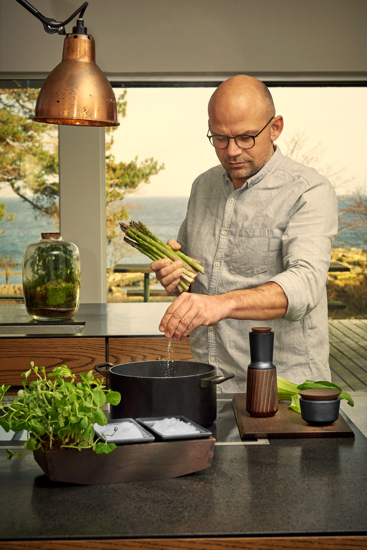 Jesper Vollmer in a kitchen with herbs