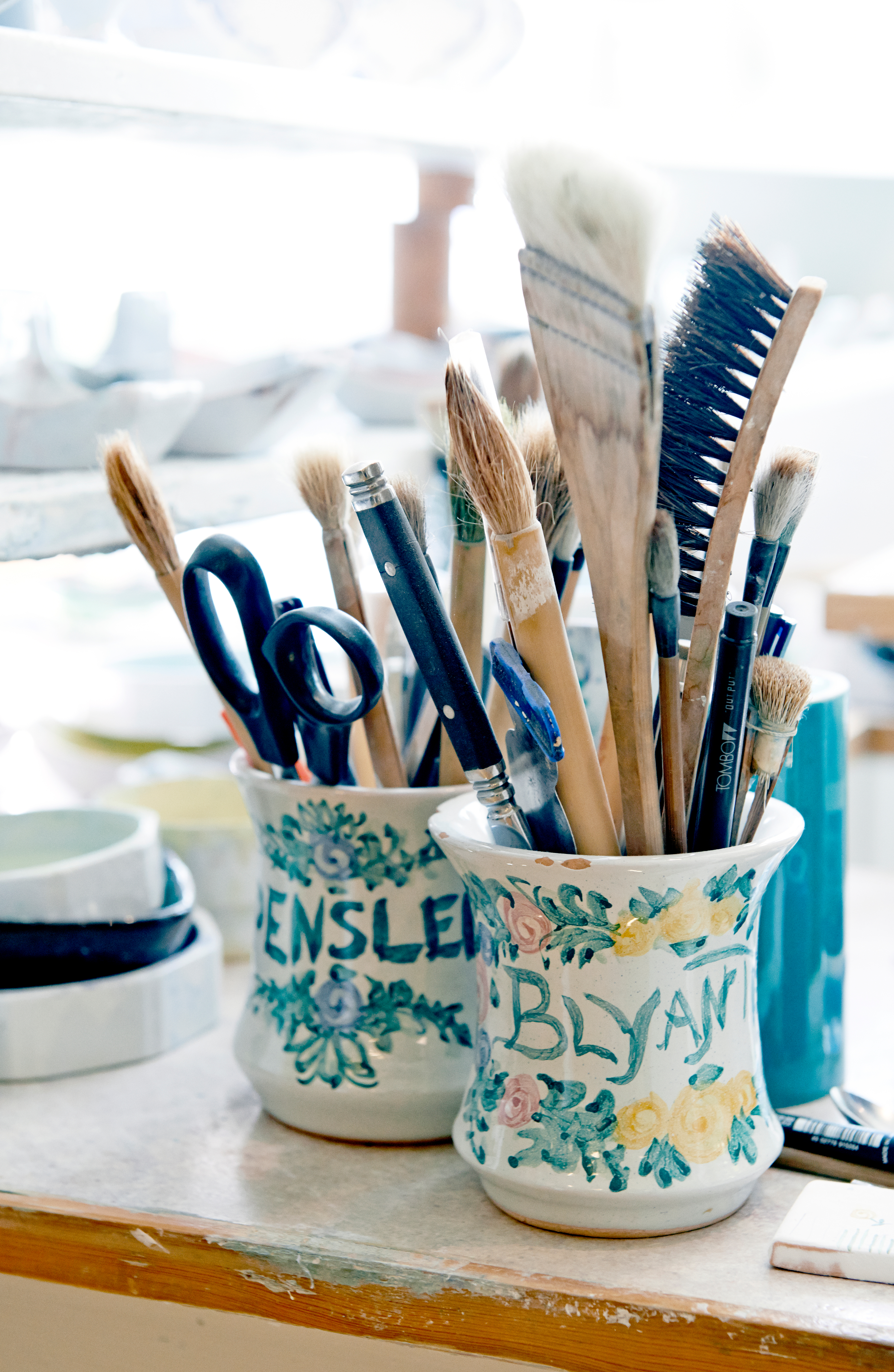 Mugs with pencils, brushes and other painting equipment on board at Bjørn Wiinblad