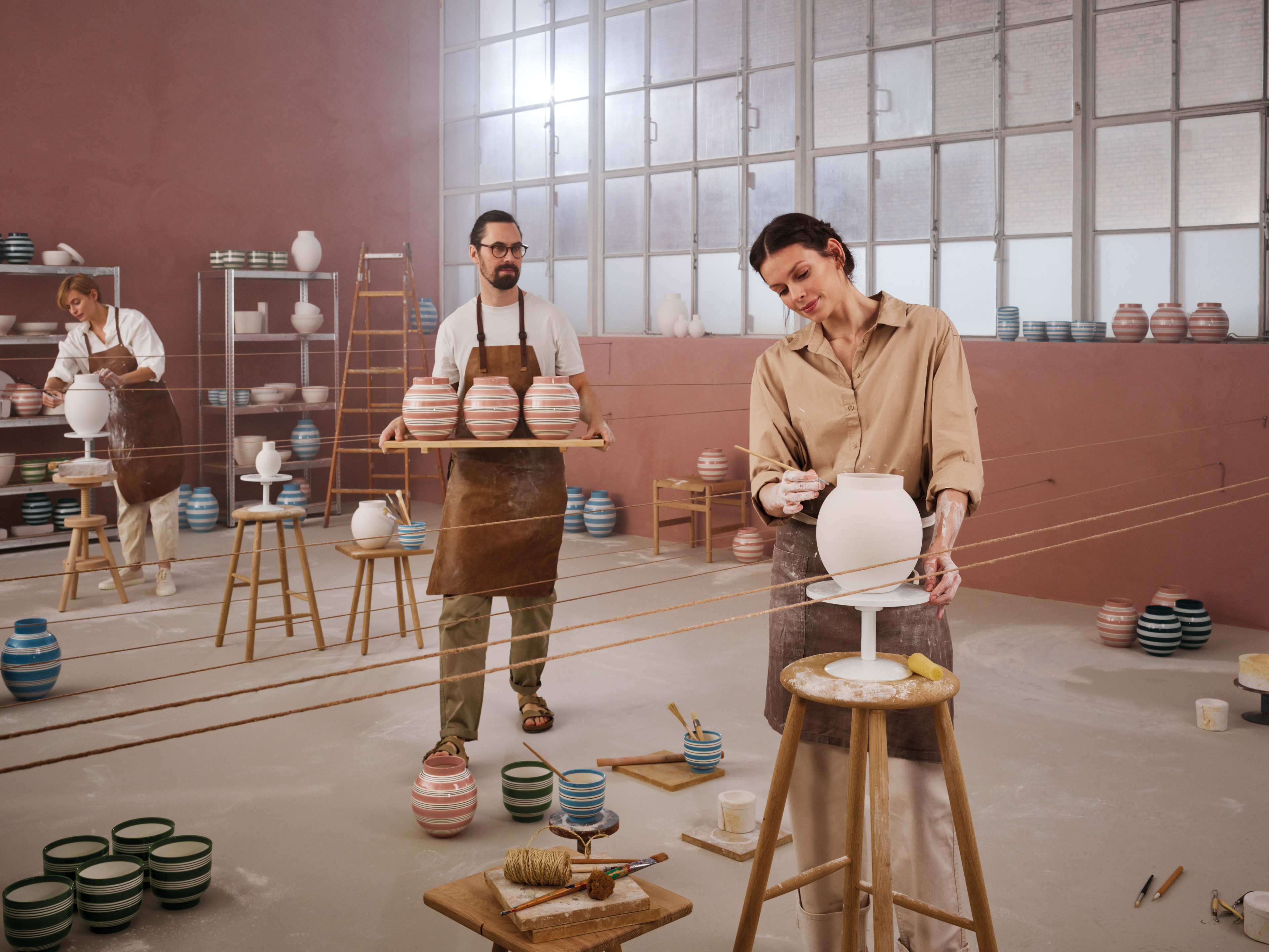 Vases are cast, turned and painted by artists