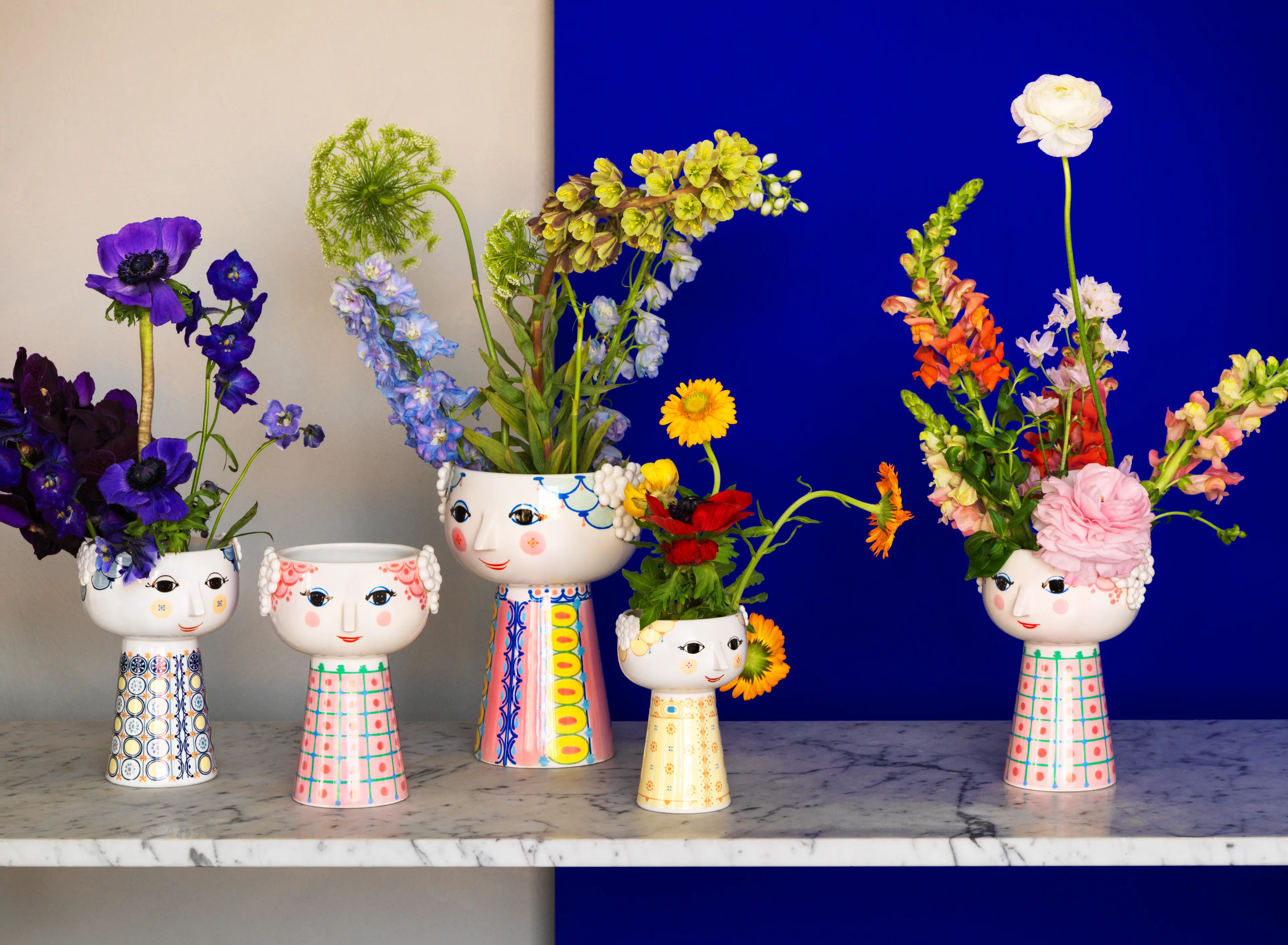 Eva vases from Bjørn Wiinblad on shelf with blue background