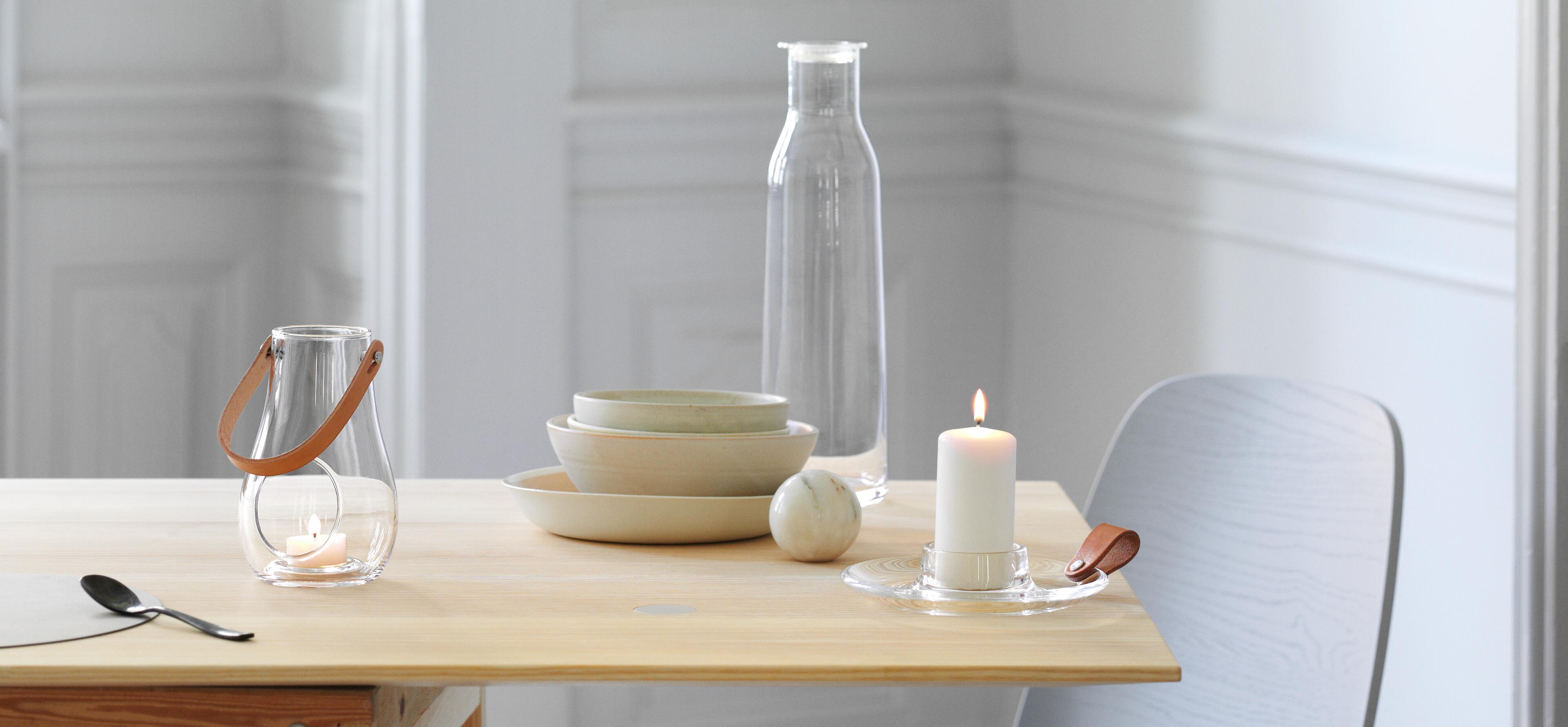 Pillar candleholders in glass and porcelain. Pillar candleholders in glass and tealight holder in glass from Rosendahl