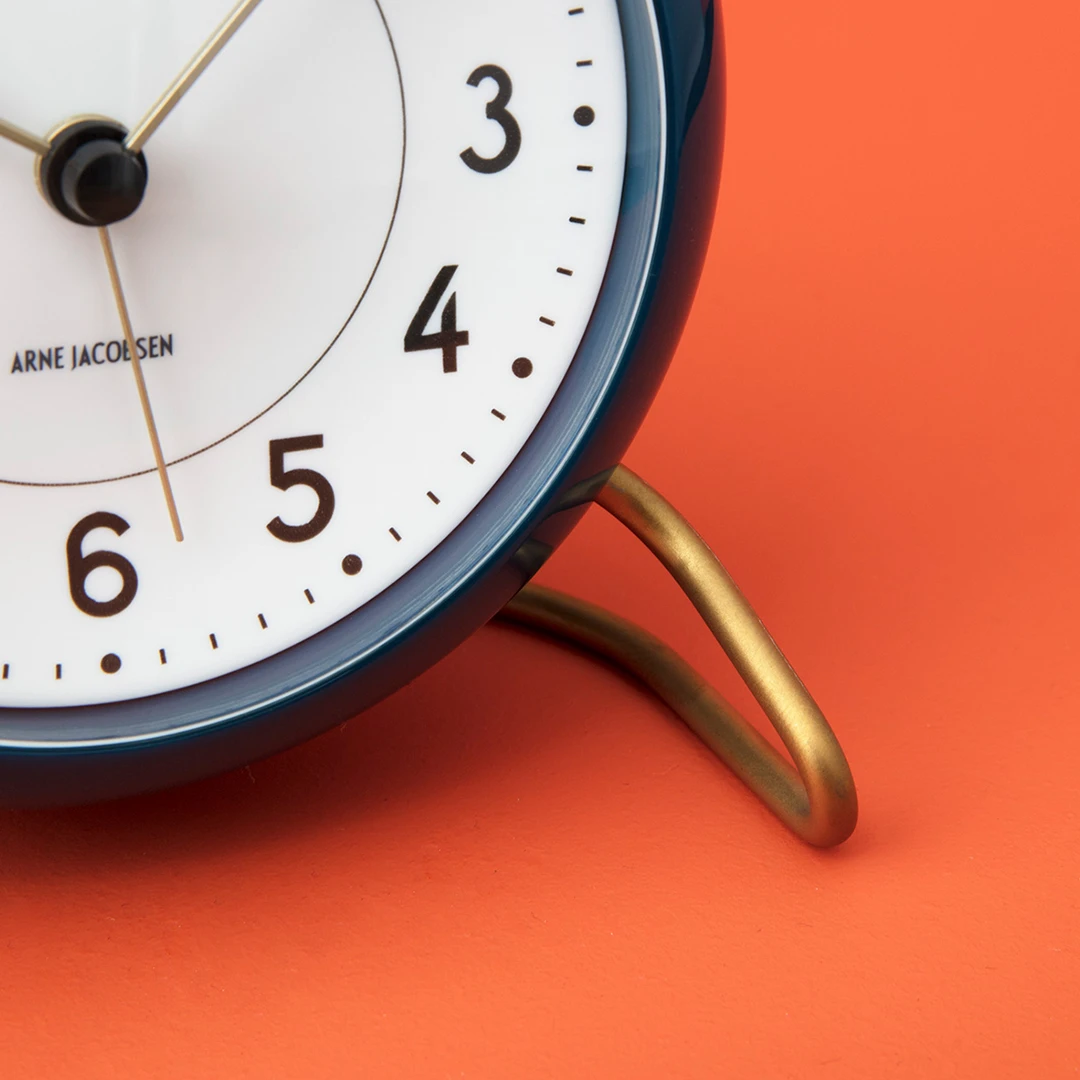 Table clock Ø11 cm from Arne Jacobsen in Teal/White color, made of Plastic