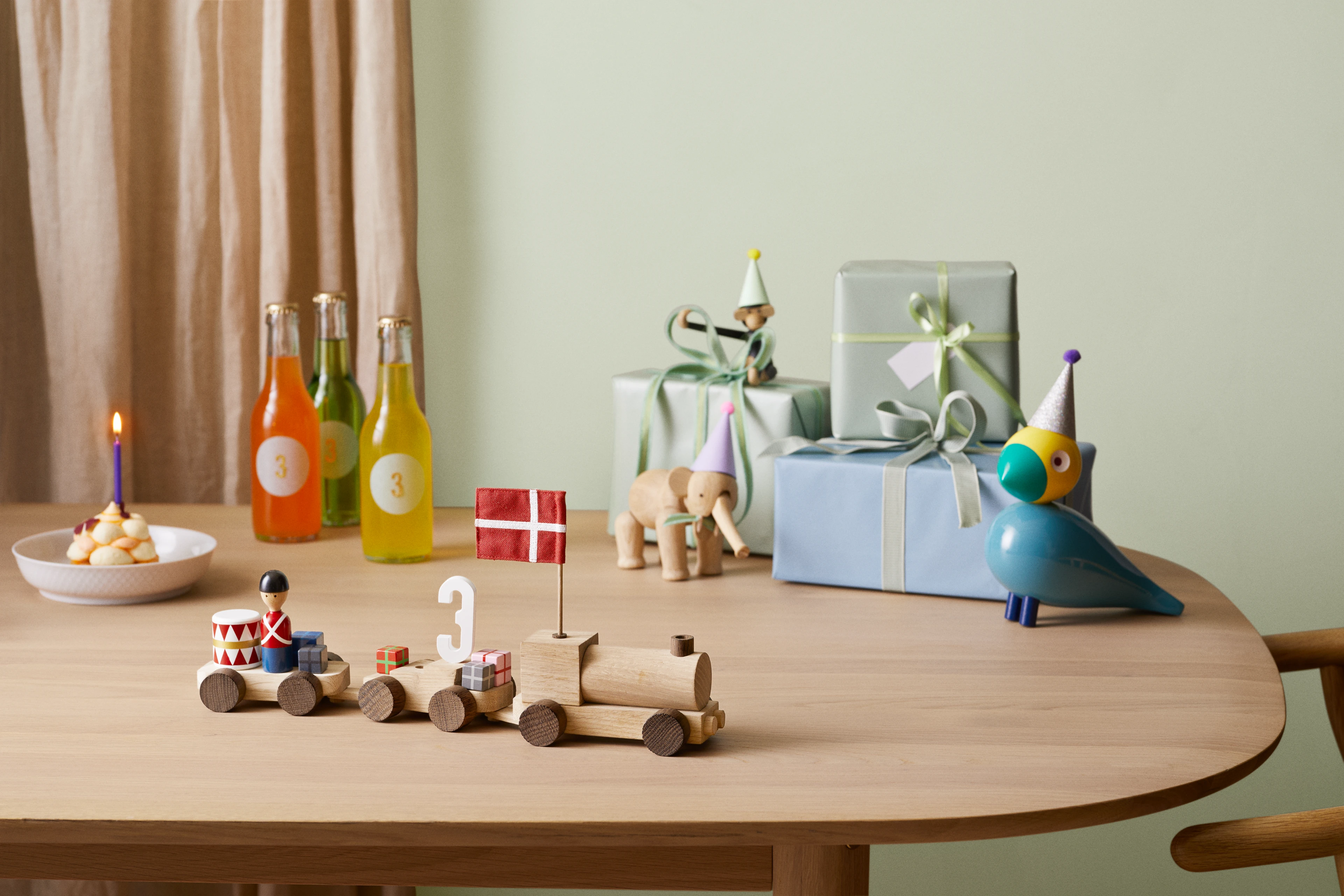 Birthday train Danish from Kay Bojesen in Oak/Smoked oak color, made of Wood