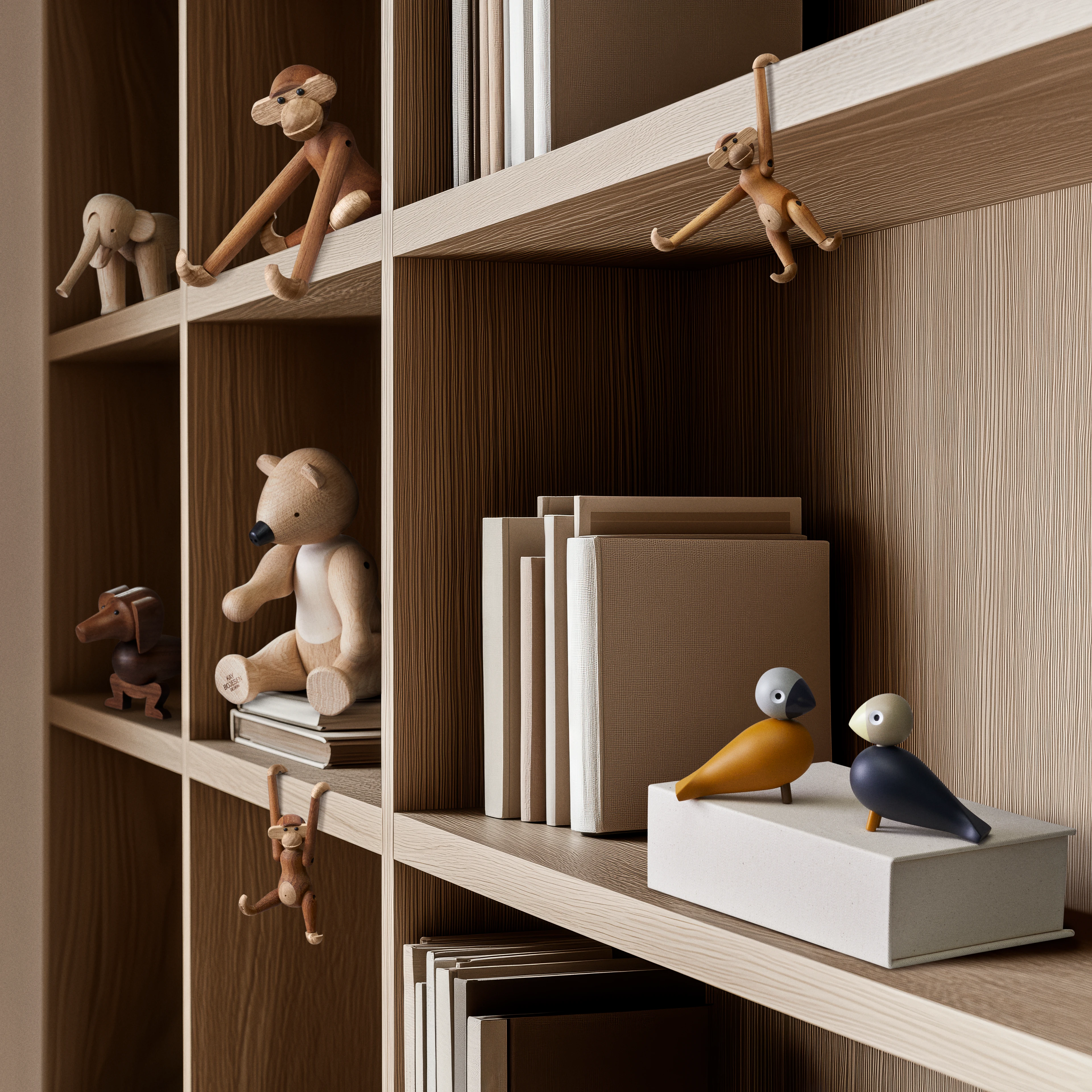 A collection of Kay Bojesen wooden figures displayed in a showcase