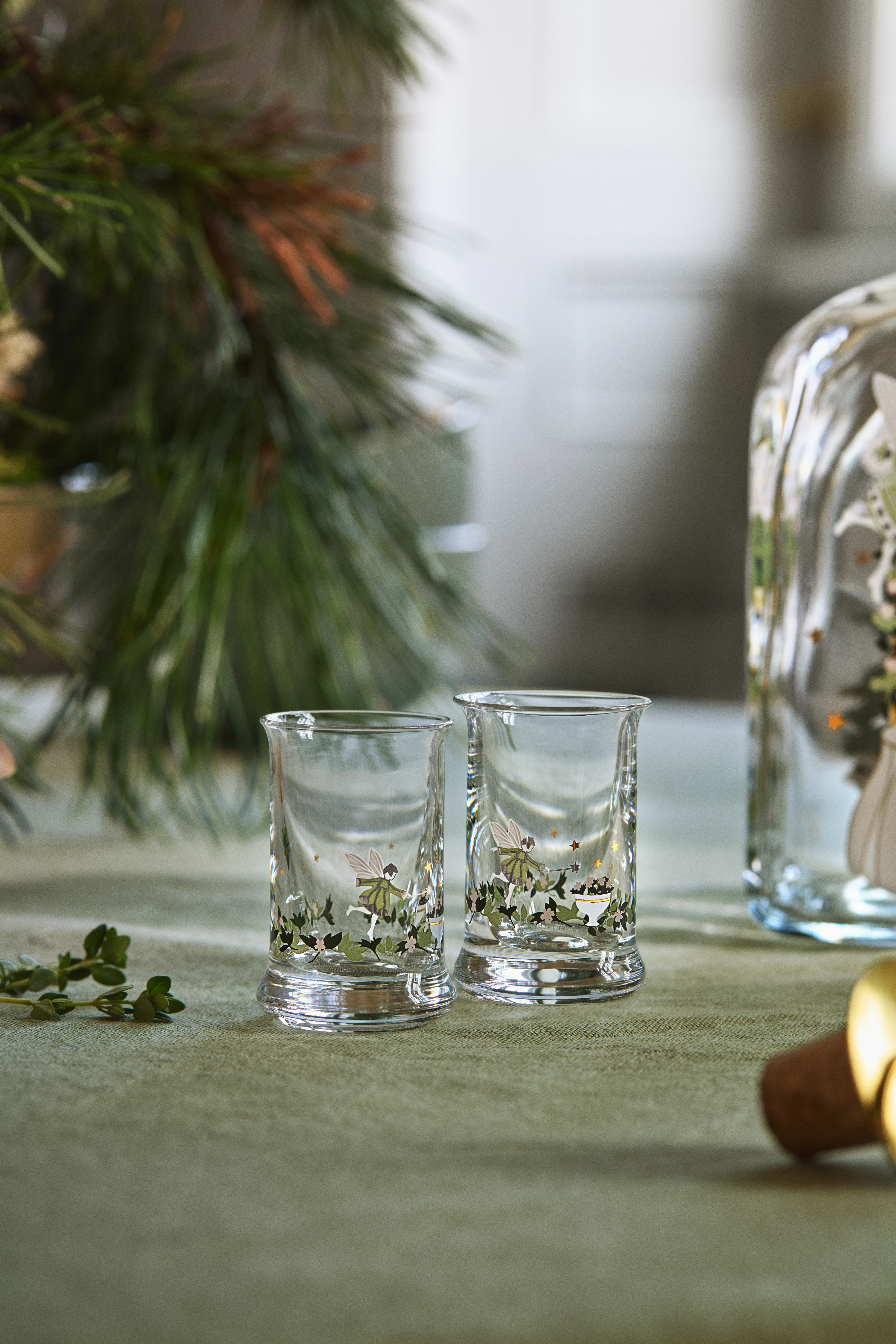 Christmas bottle and two glasses in snow-cold forest from Holmegaard