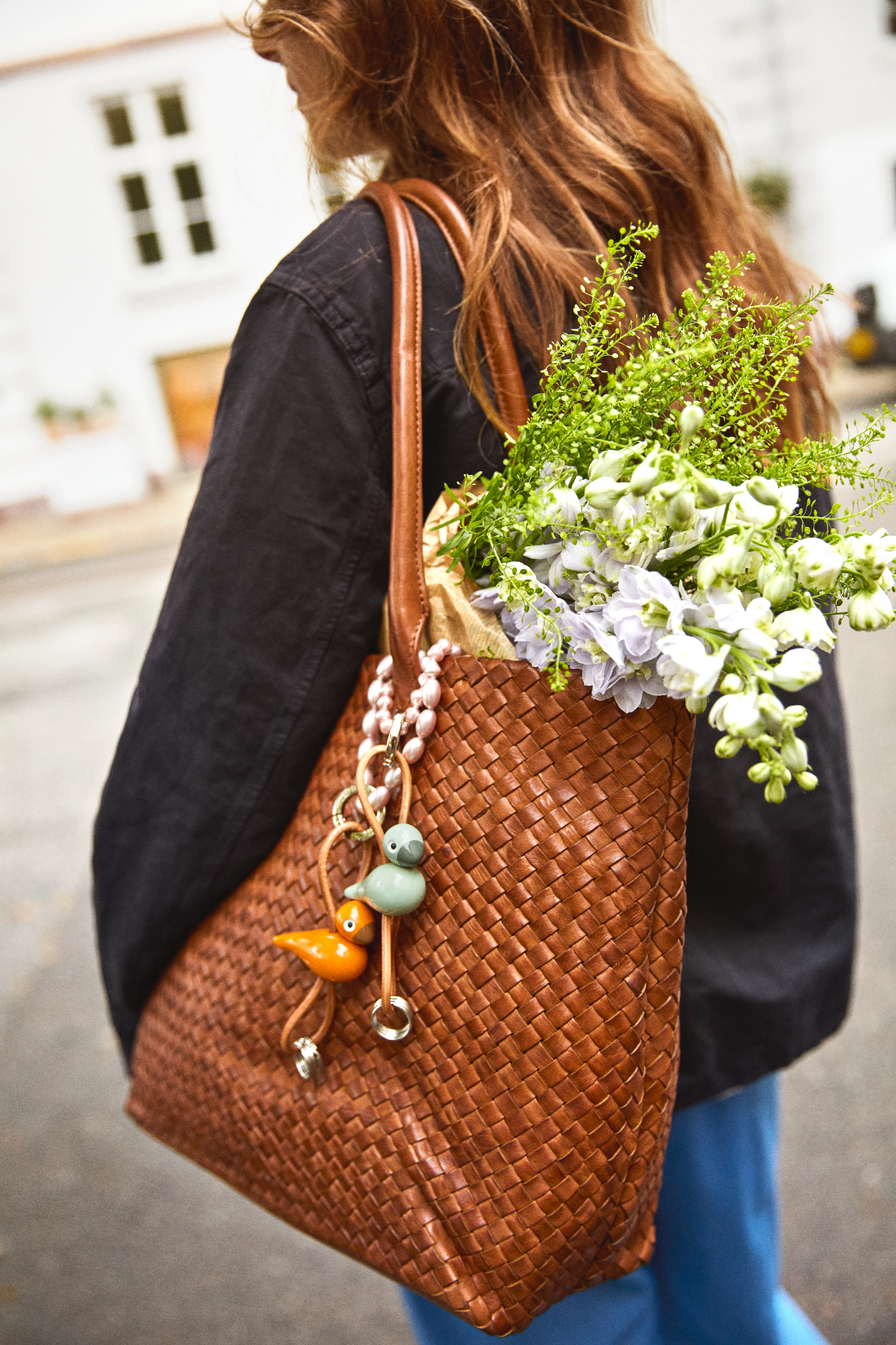 Fugl sølvtonet metal nøglering med naturlæder fra Kay Bojesen i farven Orange, lavet af Træ