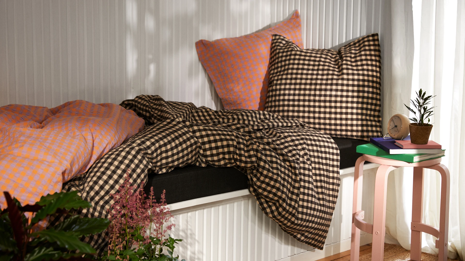 JUNA bed linen in brown and orange checks on bed, modern and colorful bedroom design