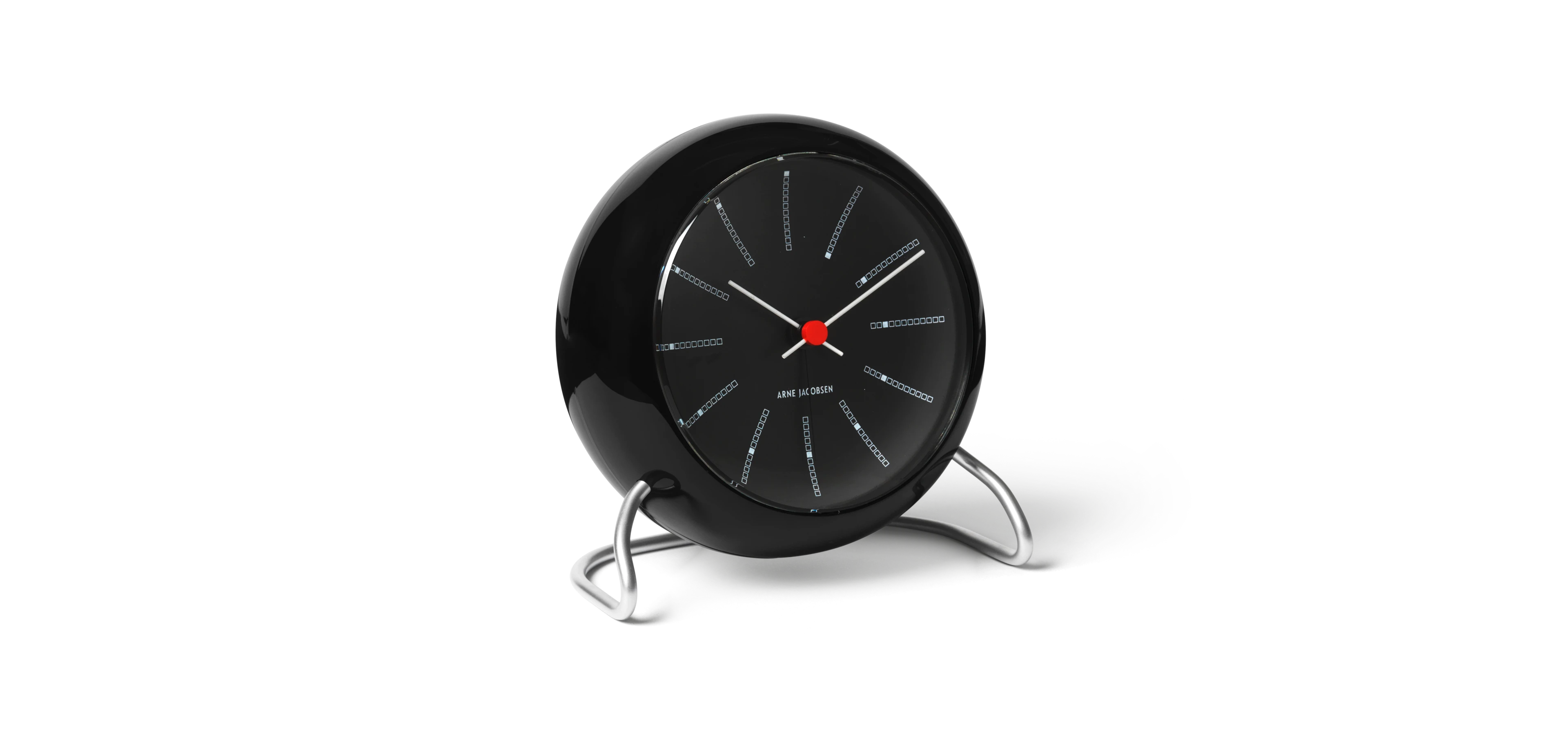 Table clock Ø11 cm from Arne Jacobsen in Black color, made of Plastic