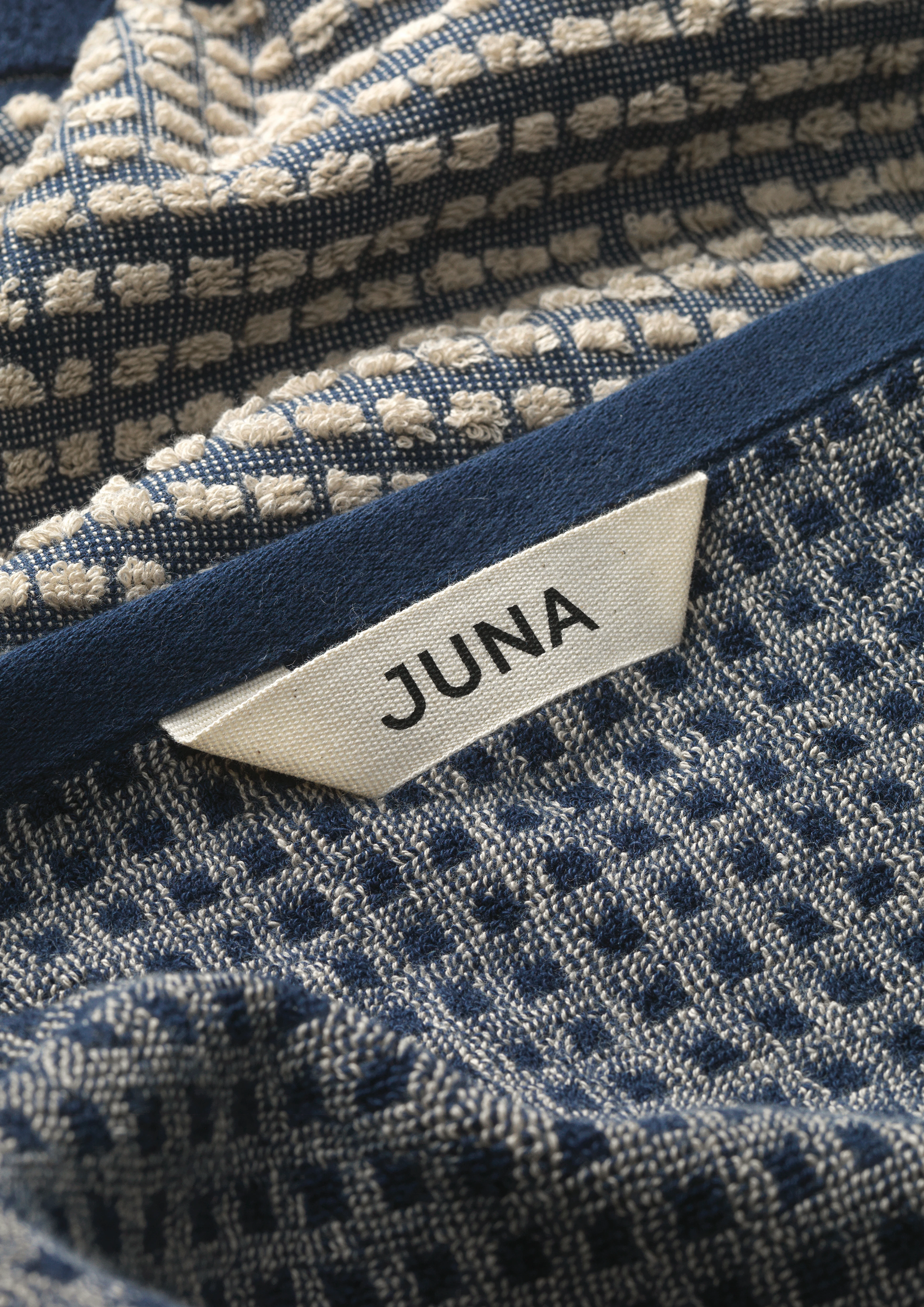 Towel 50x100 cm from JUNA in Dark blue/Sand color, made of Cotton
