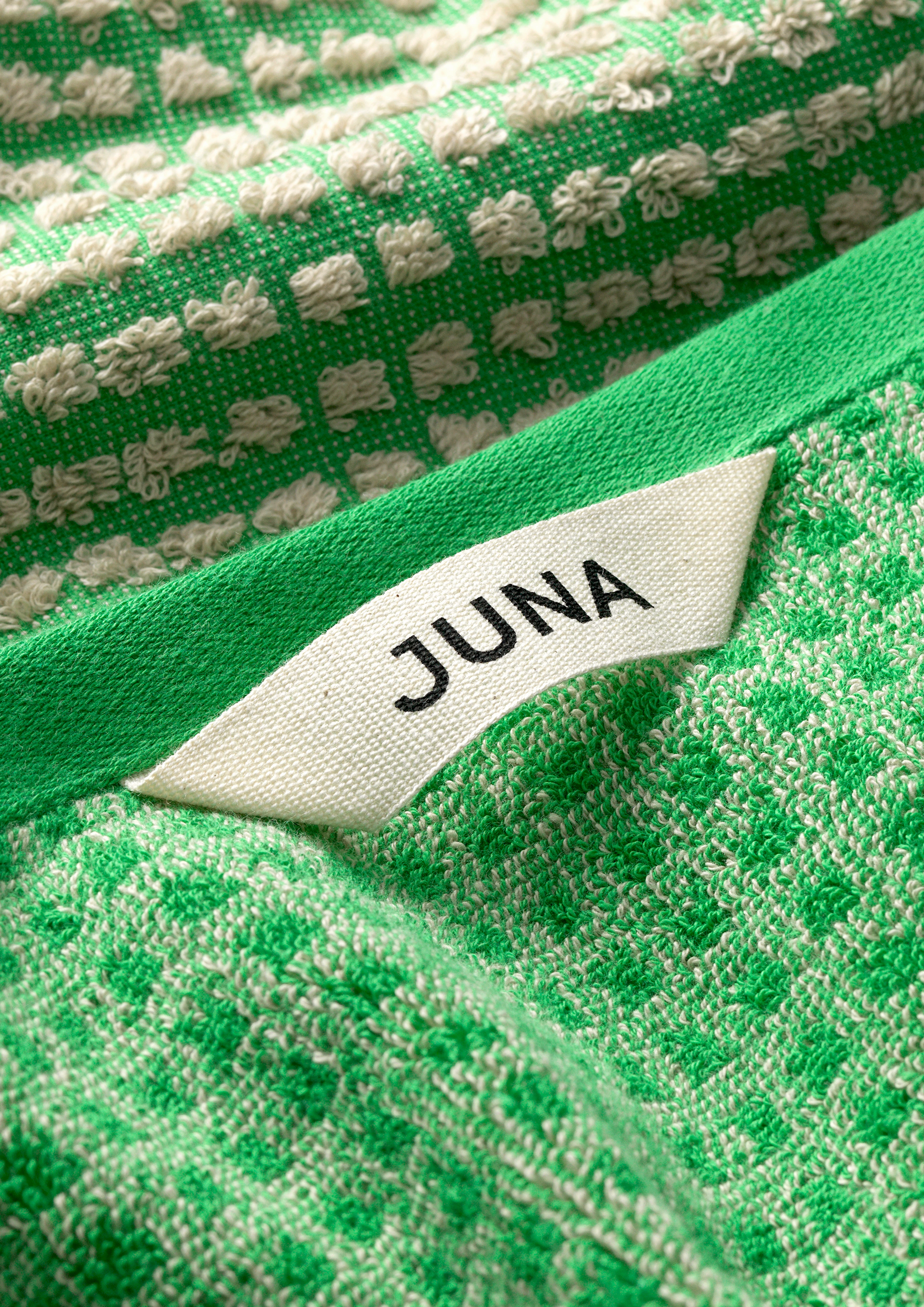 Towel 50x100 cm from JUNA in Green/Sand color, made of Cotton