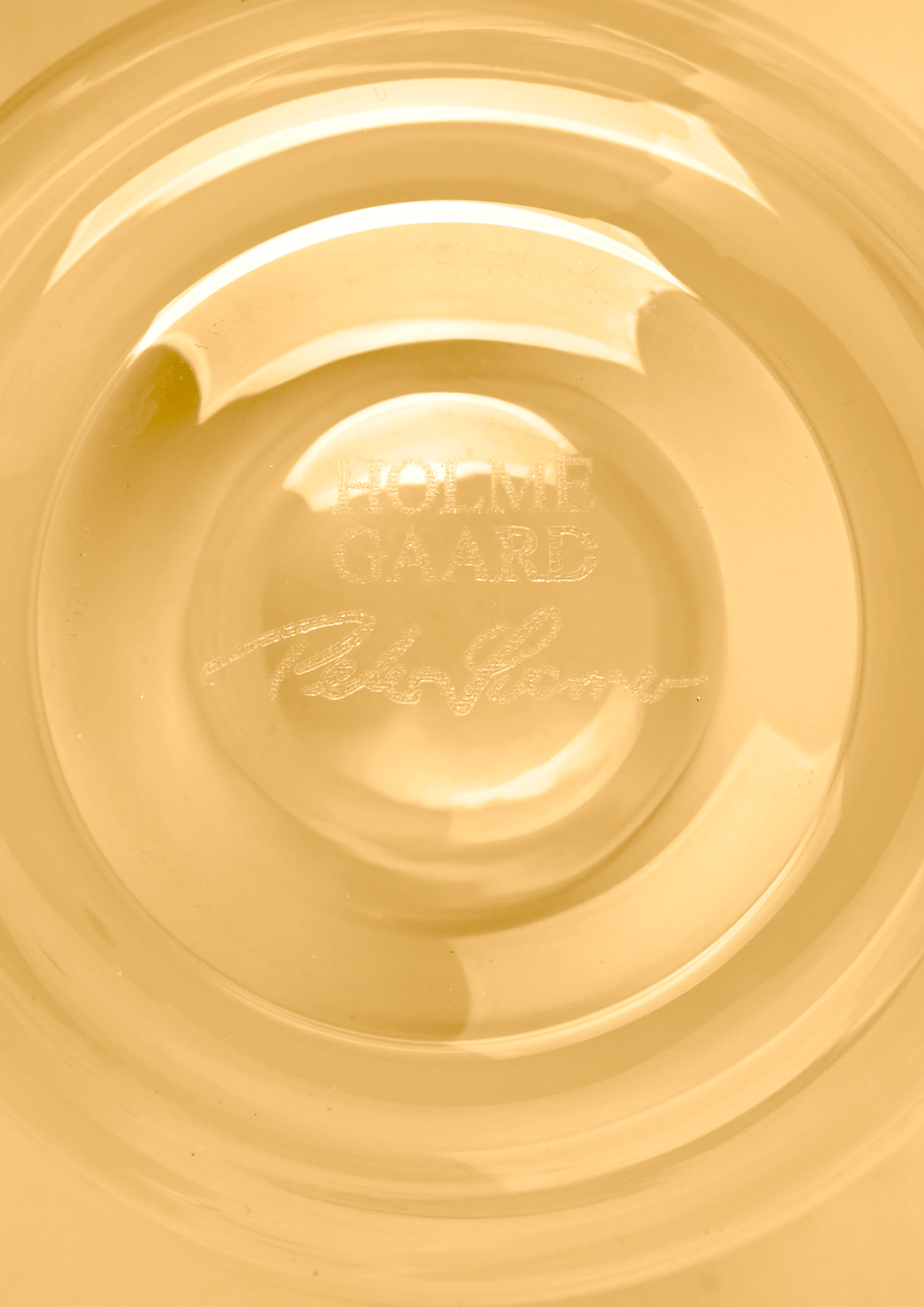 Ljuslykta Ø8.5 cm från Holmegaard i färgen Amber, tillverkad av Glas